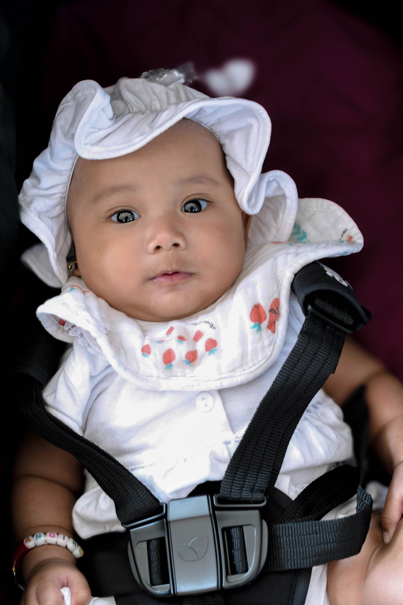 Baby secured in a child seat